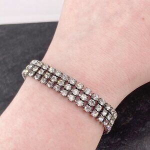 Vintage silver tone metal clear rhinestone triple layer tennis bracelet c. 1950s